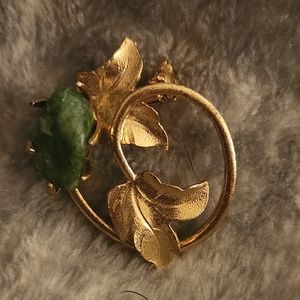 Vintage flower pin with green stone